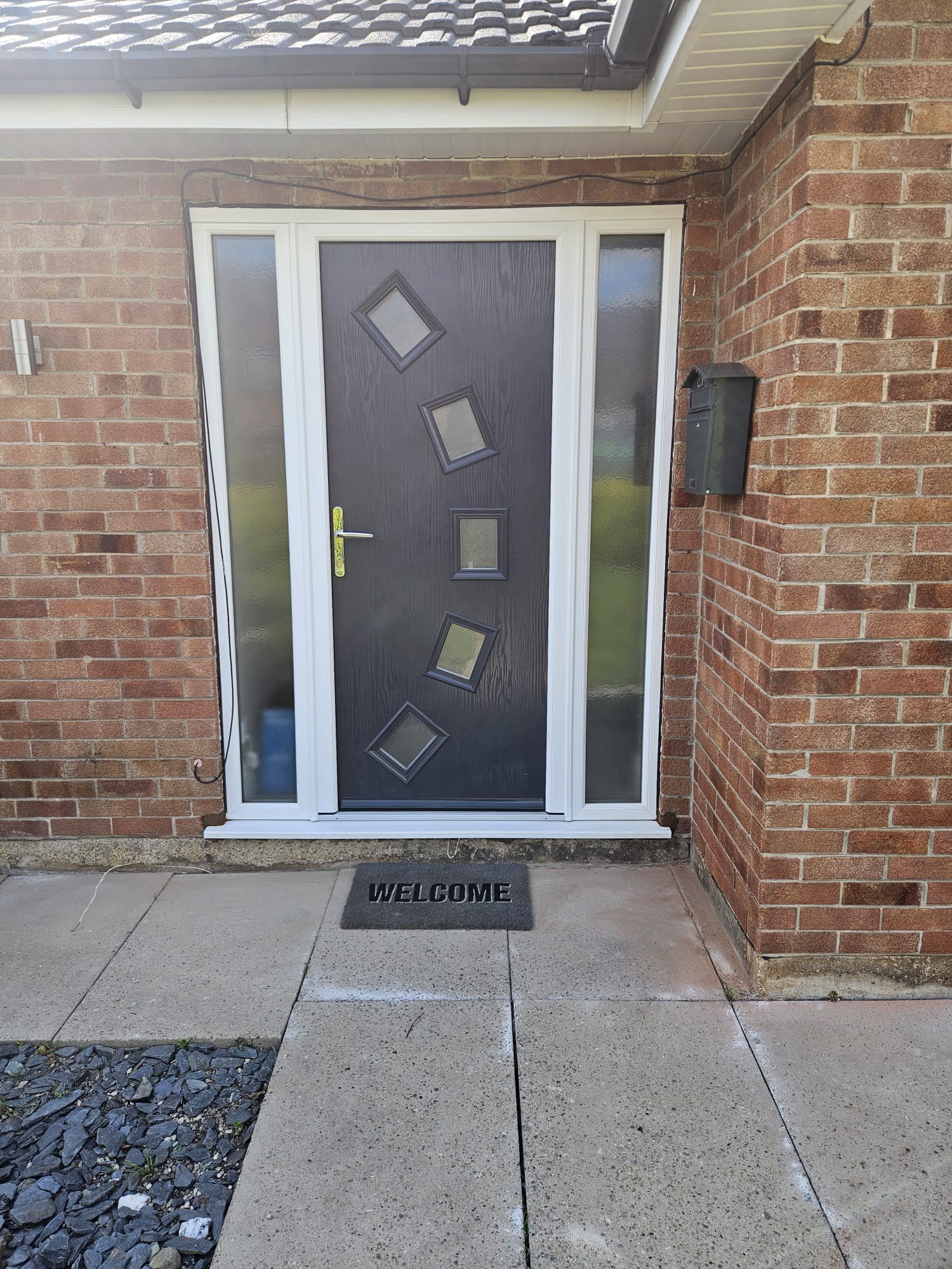 A modern, welcoming grey front door