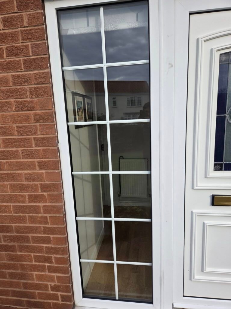 new, clean windows next to a front door